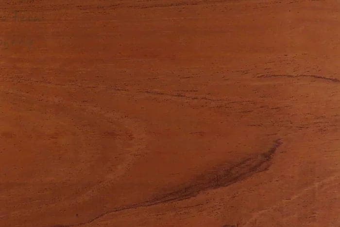 African mahogany (khaya) surface: red-brown mahogany, close-up.