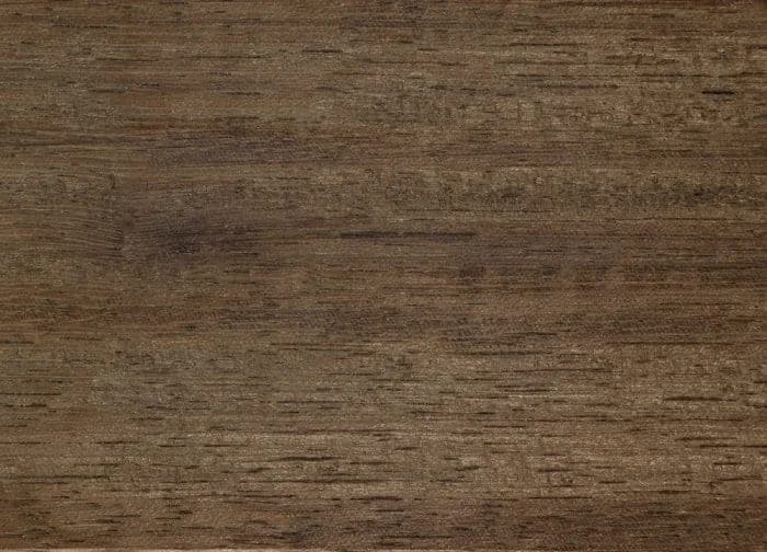 Iroko lumber surface: golden-brown, coarse-textured wood, close-up.
