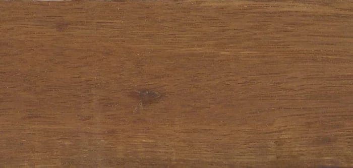 Limbali lumber surface: brown, straight-grained wood, close-up.