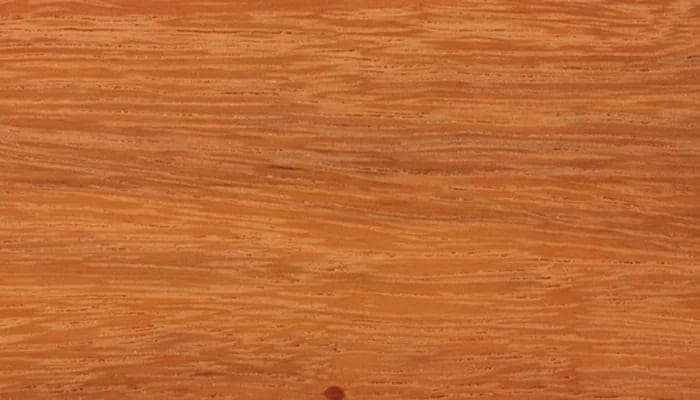 Tali lumber surface: orange to red-brown wood, close-up.