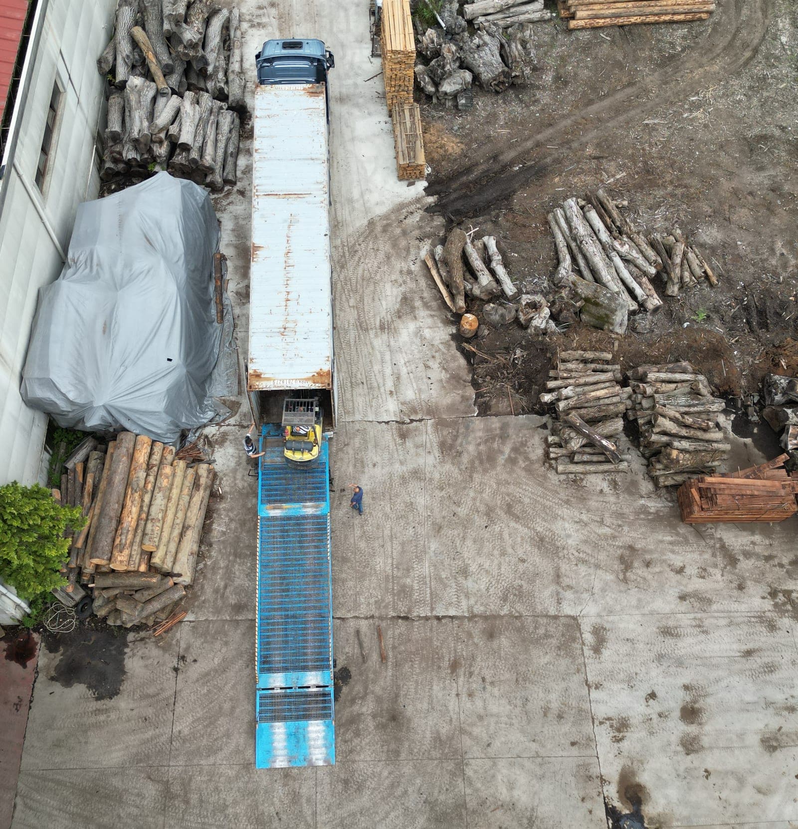 Loading a container by forklift at our facility, top-down view.