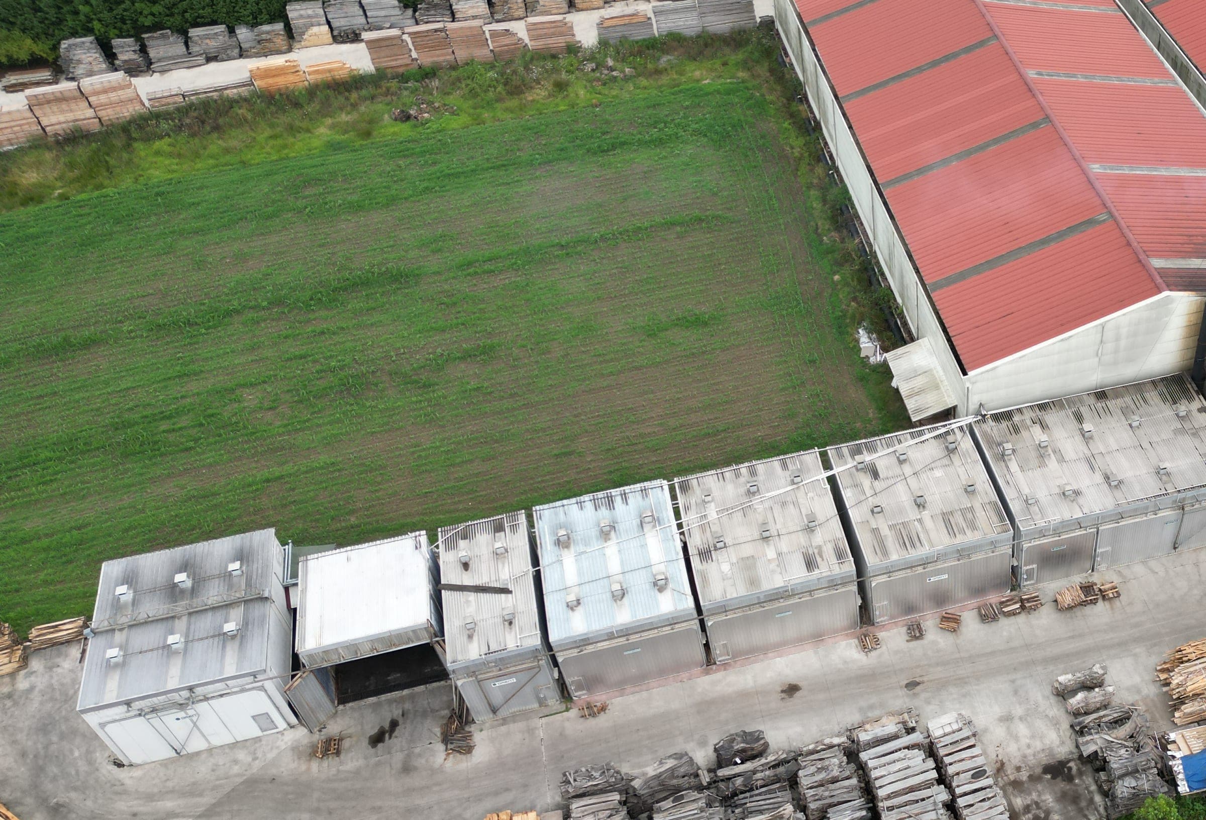 Aerial view of our facility: the row of drying kilns and the production hall.